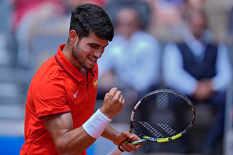 Carlos Alcaraz reacts after scoring a point against Felix Auger-Aliassime